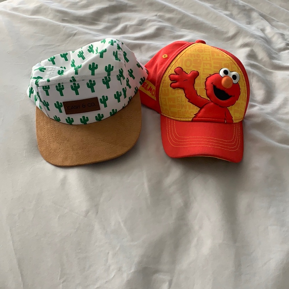 2 baby hats.  Adjustable back snaps